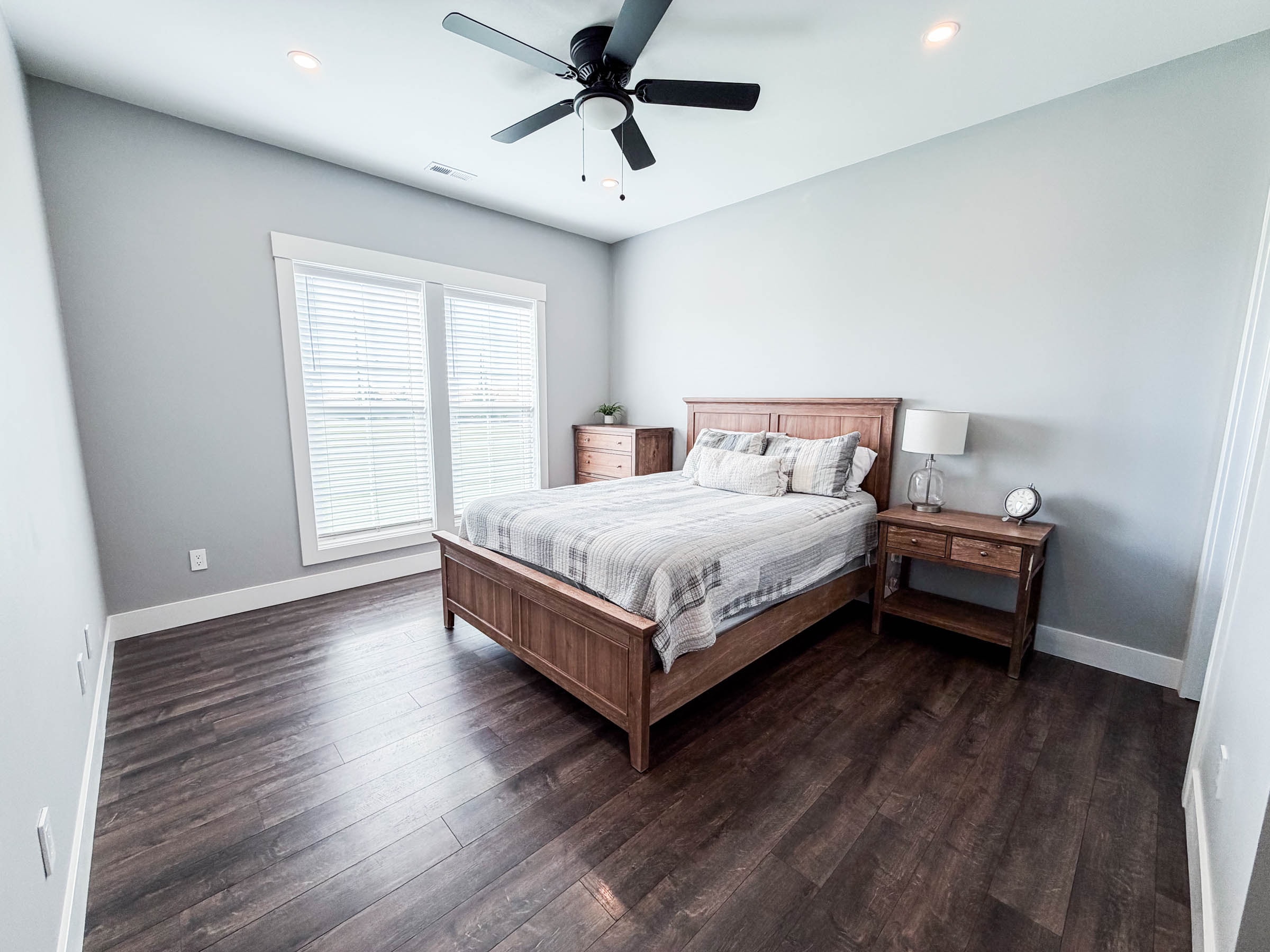 Bedroom 4 with white bed frame and French doors