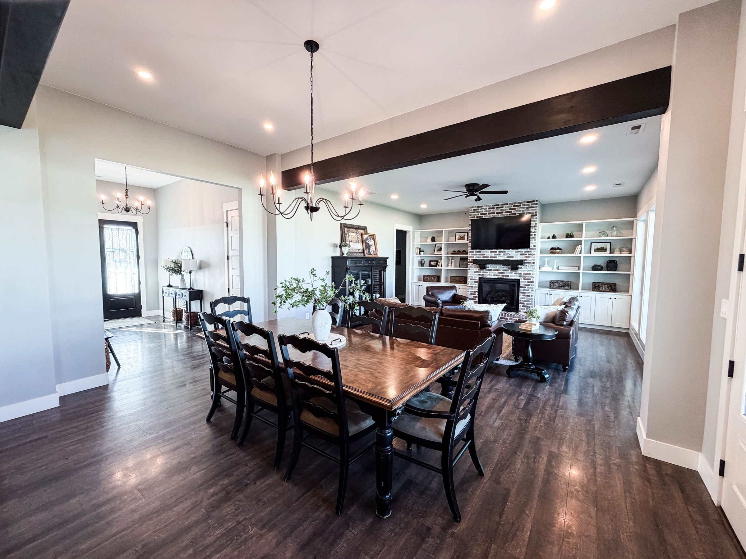 Dining room looking toward family room with fireplace beyond