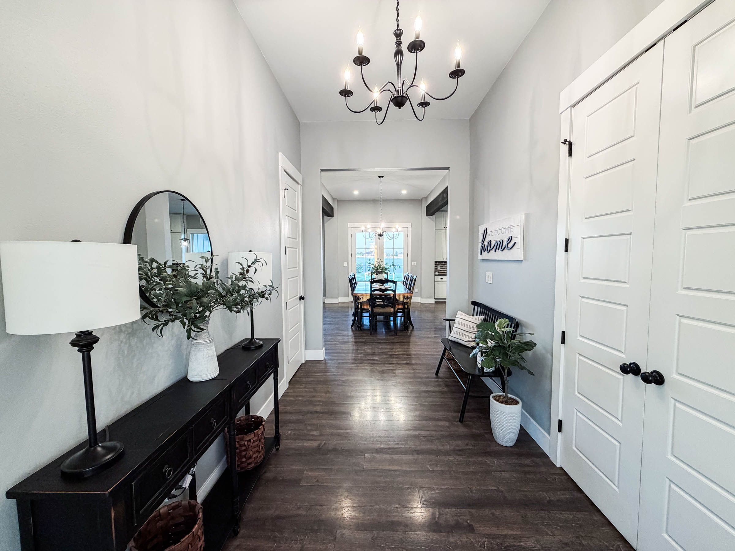 Foyer with chandelier and hardwood floors
