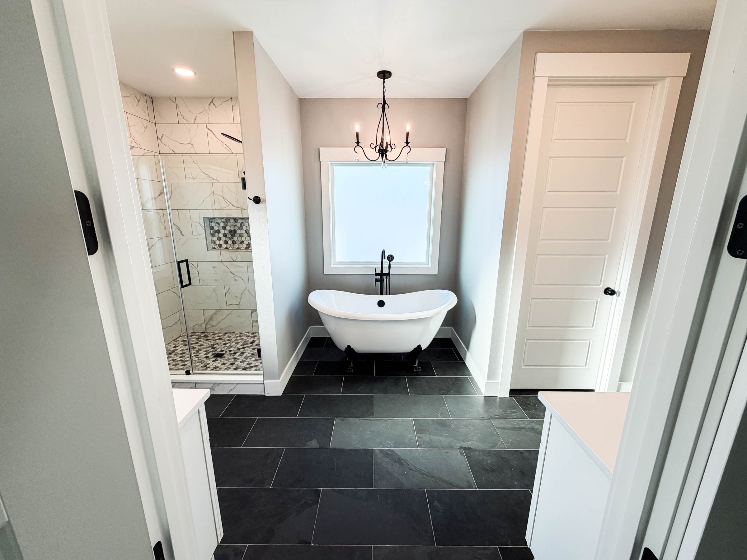 Primary bathroom with soaking tub, shower, and toilet