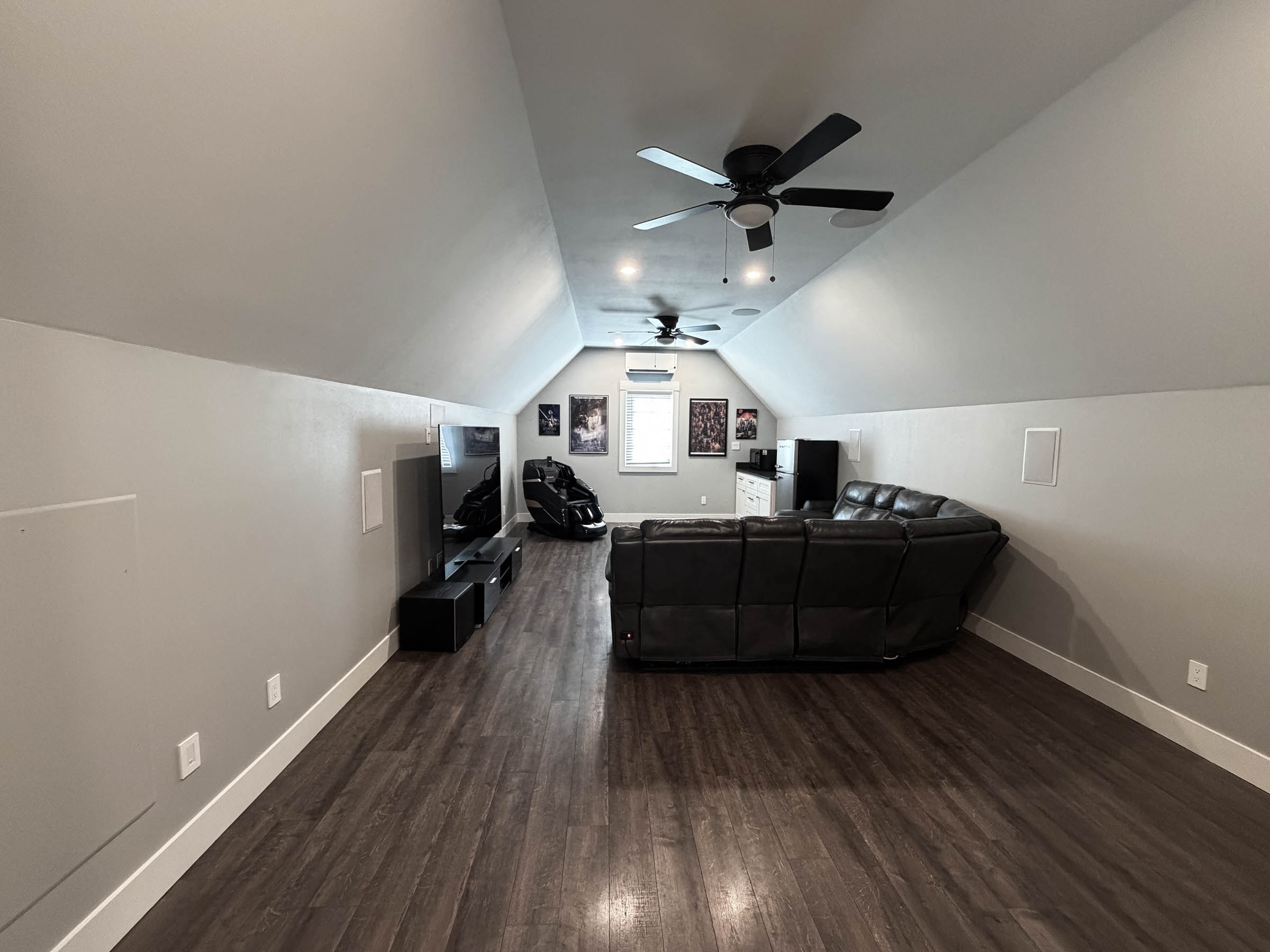 Bonus room with leather seating and entertainment area